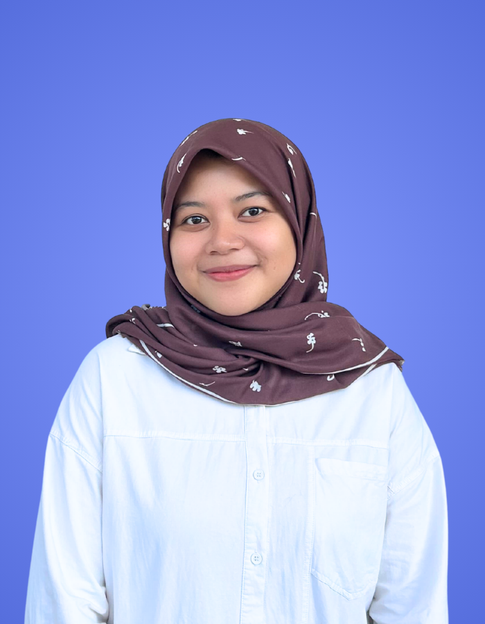 Team member profile photo of a woman wearing a hijab on a blue background for Our Team page.