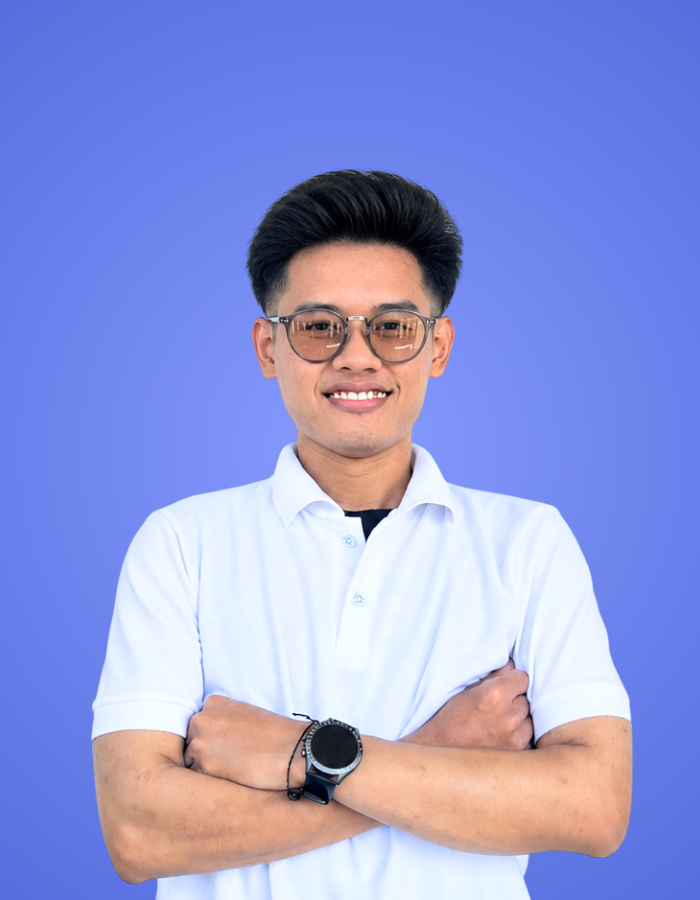 Team member profile photo of a smiling man wearing glasses for Our Team page.